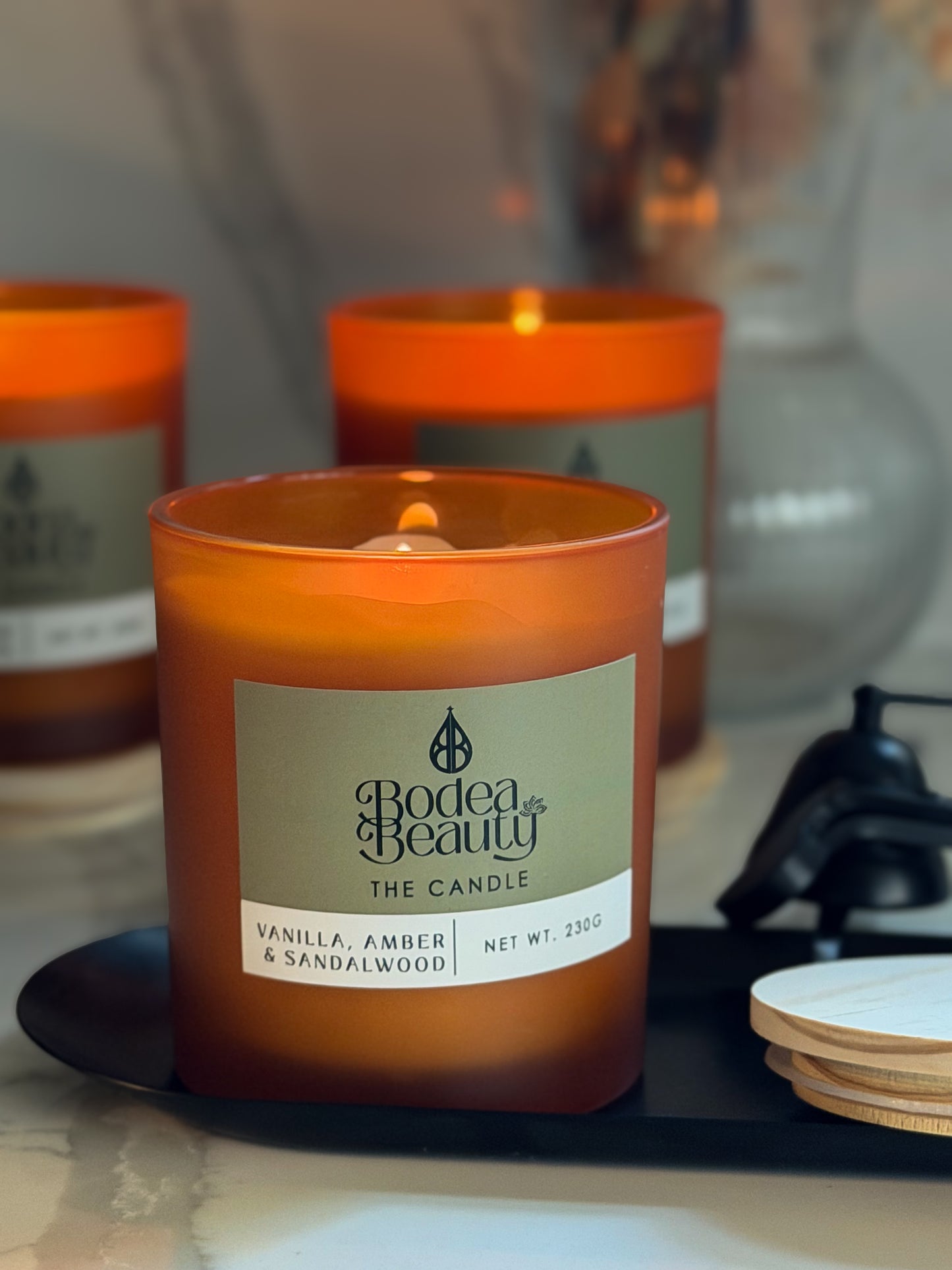 The Candle - Vanilla · Amber · Sandalwood